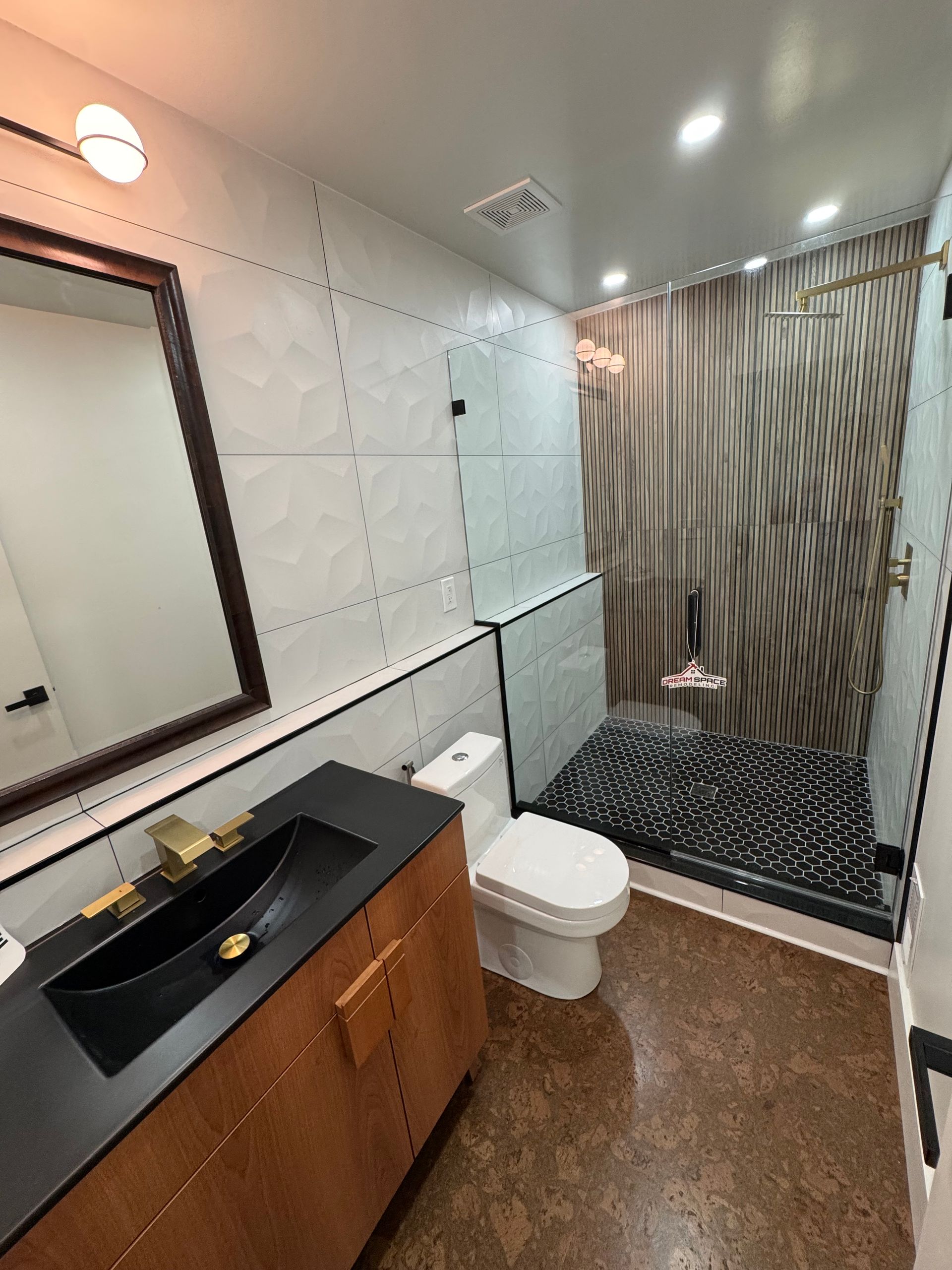 Luxury bathroom remodel in Baltimore, MD with modern vanity and walk-in shower.