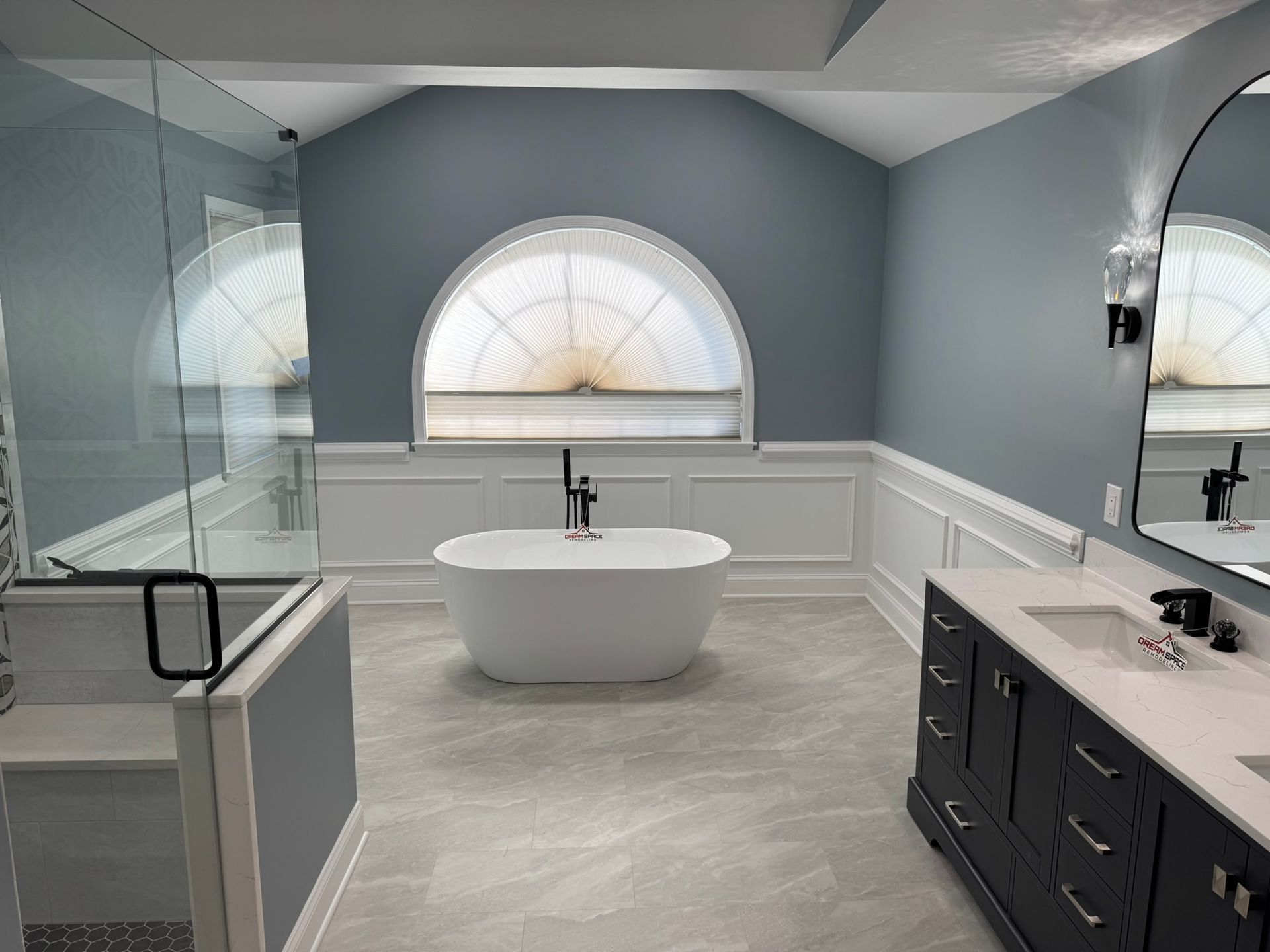 Spa-inspired master bathroom design with freestanding soaking tub, double vanity, and tiled custom shower – DreamSpace Remodeling Perry Hall MD