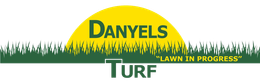 Logo for Danyels Turf. Yellow sun shape, green text and grass graphic. 