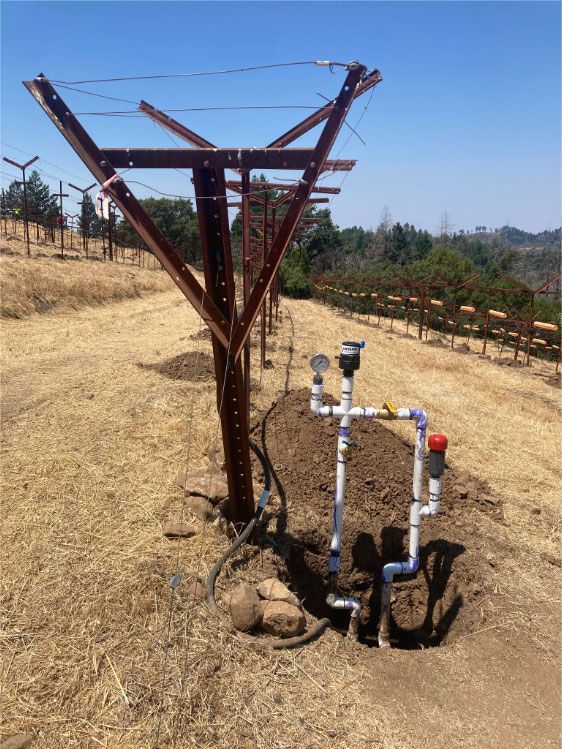 Trellising equipment and irrigation piping laid during sustainable vineyard farming replant on Spring Mountain