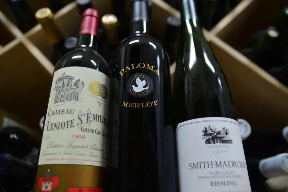 Three bottles of wine including paloma and smith malbon