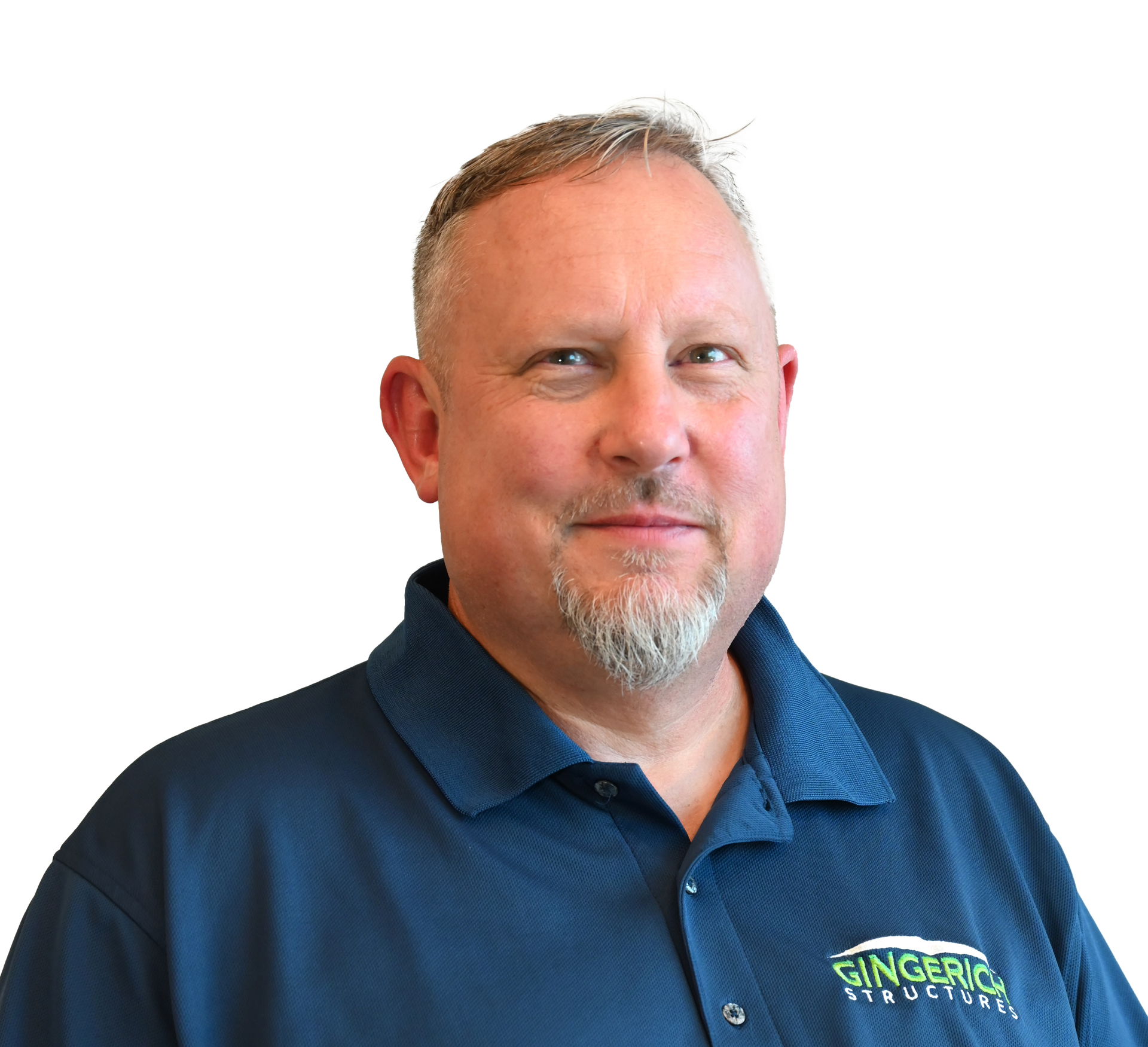 A smiling person wearing a navy blue polo shirt with a Gingerich Structures logo, set against a plain white background.