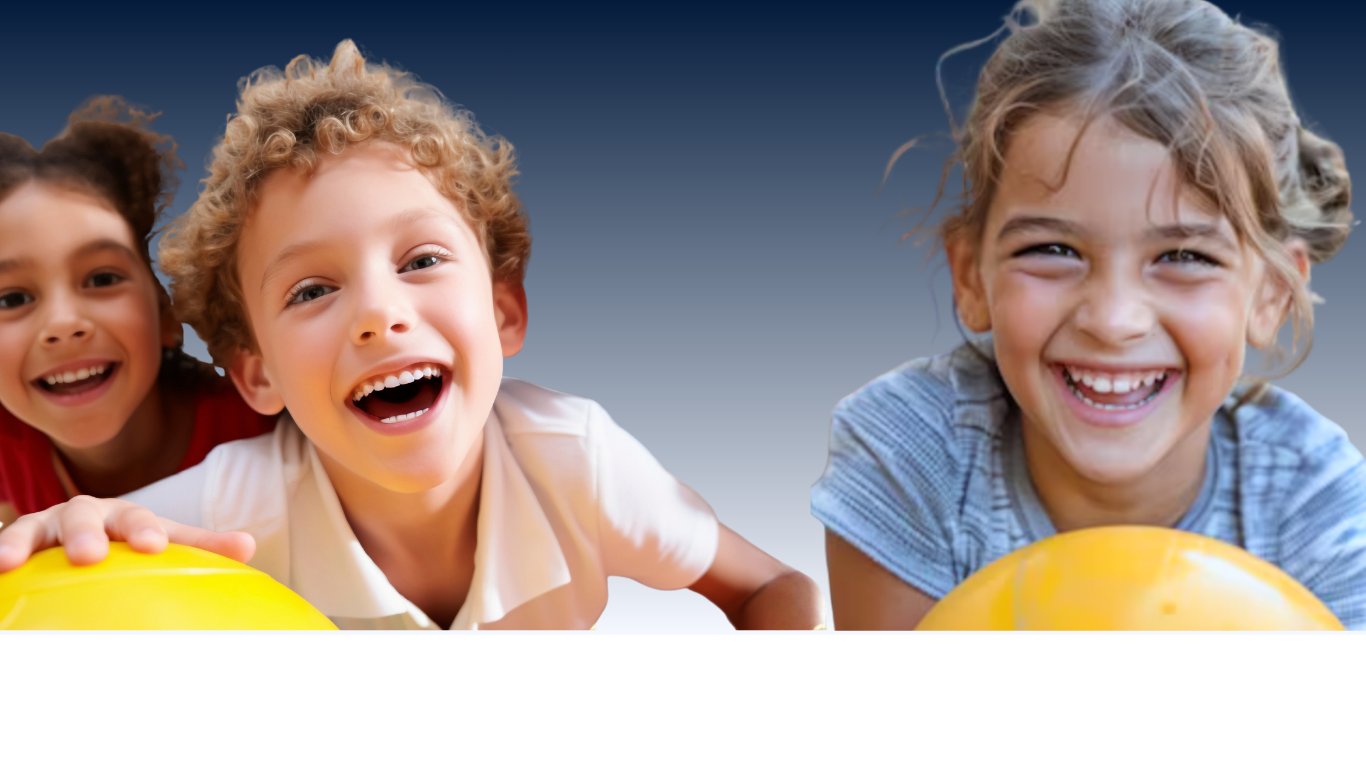 Three smiling children leaning over yellow balls against a blue background