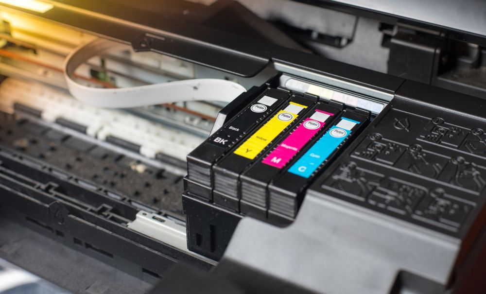 Printer Carriage With Cmyk Ink Cartridges Inside an Open Inkjet Printer — Lehmann Print Solutions in Airlie Beach, QLD