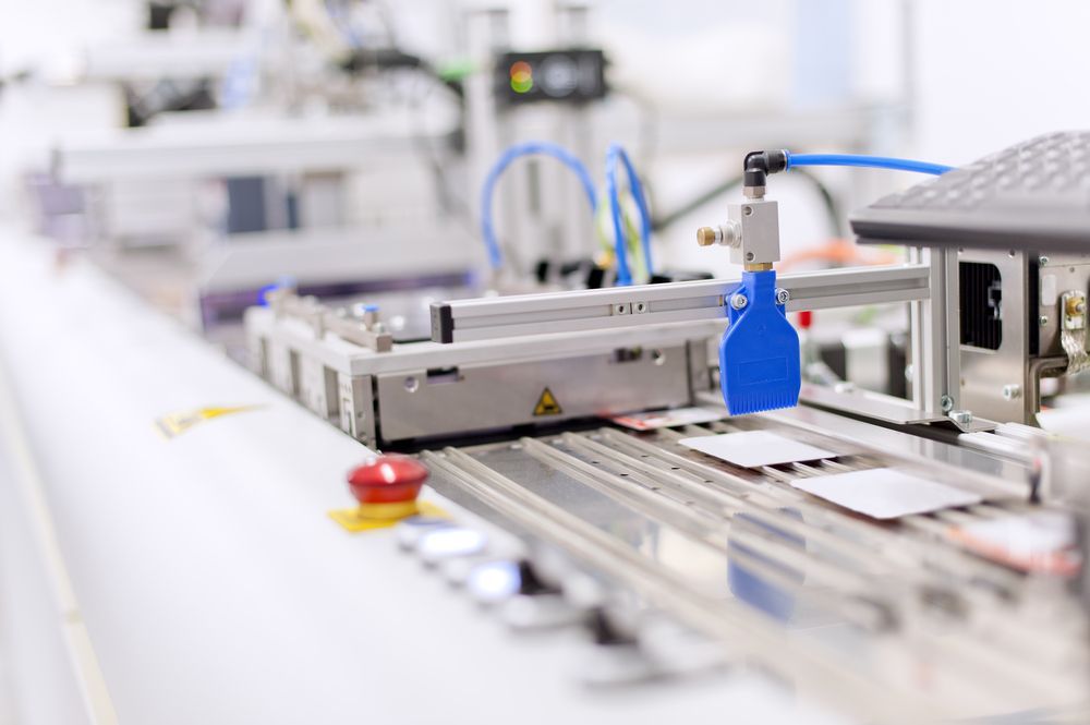Automated Factory Conveyor With a Blue Robotic Tool — Lehmann Print Solutions in Bowen, QLD