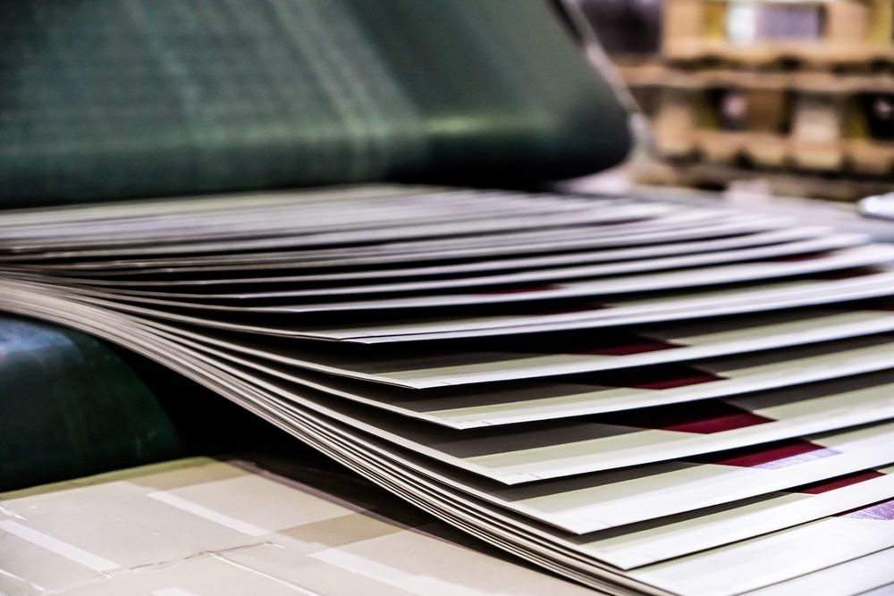 Close-up of Stacked Fabric Swatches Fanned Out on a Table — Lehmann Print Solutions in Bowen, QLD