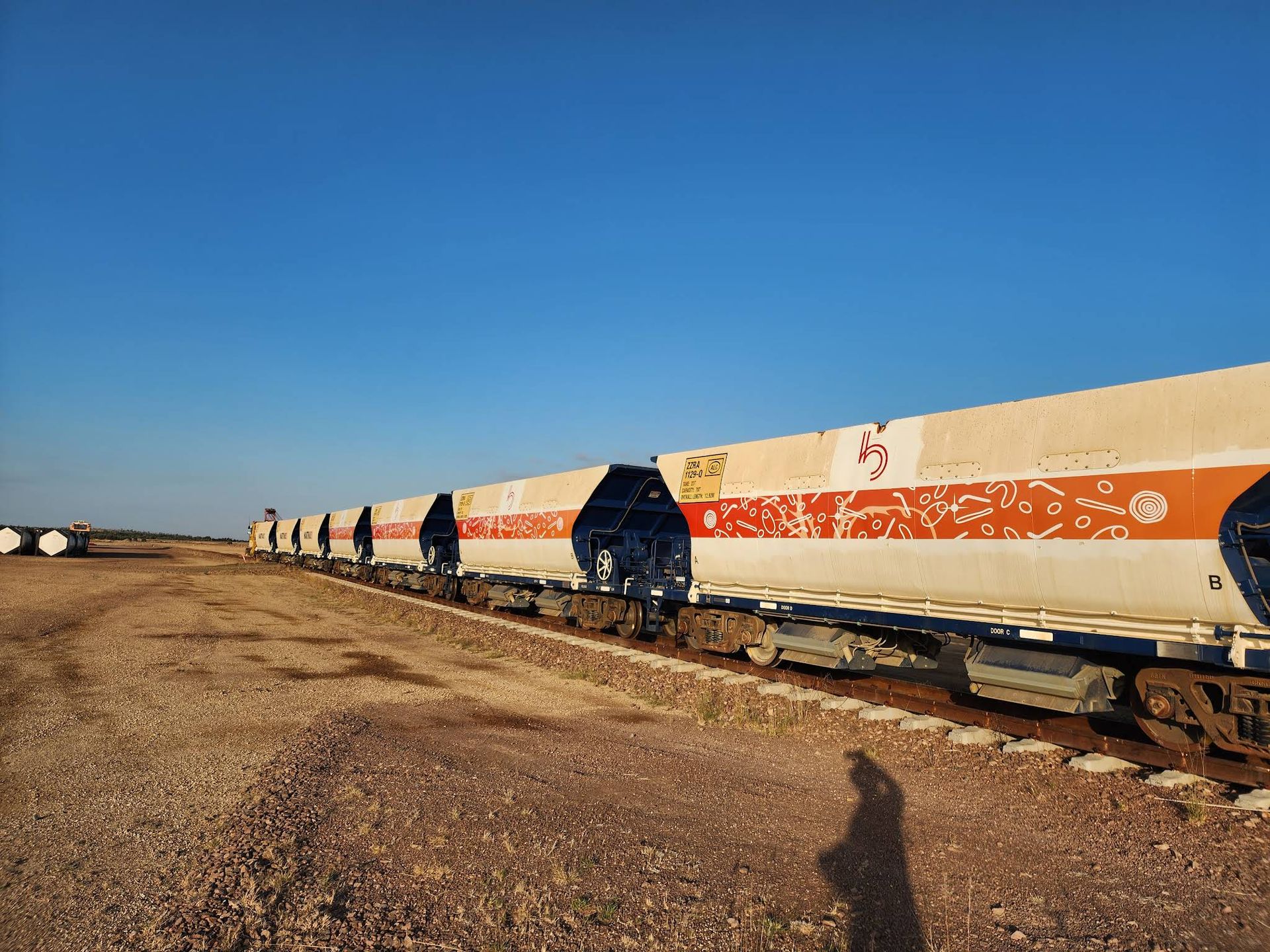Long Freight Train With White and Orange Tanker Cars — Lehmann Print Solutions in Proserpine, QLD