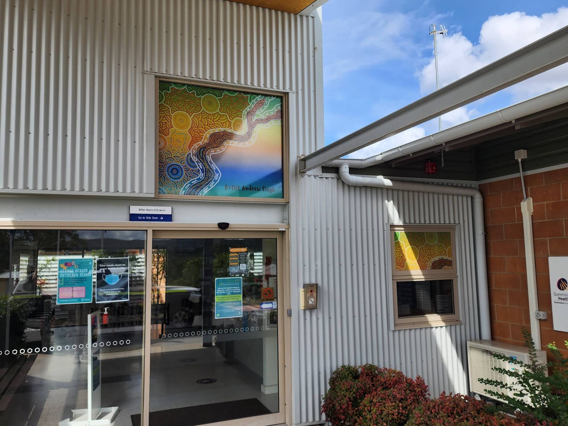 Entrance to a Modern Building With Glass Doors — Lehmann Print Solutions in Airlie Beach, QLD