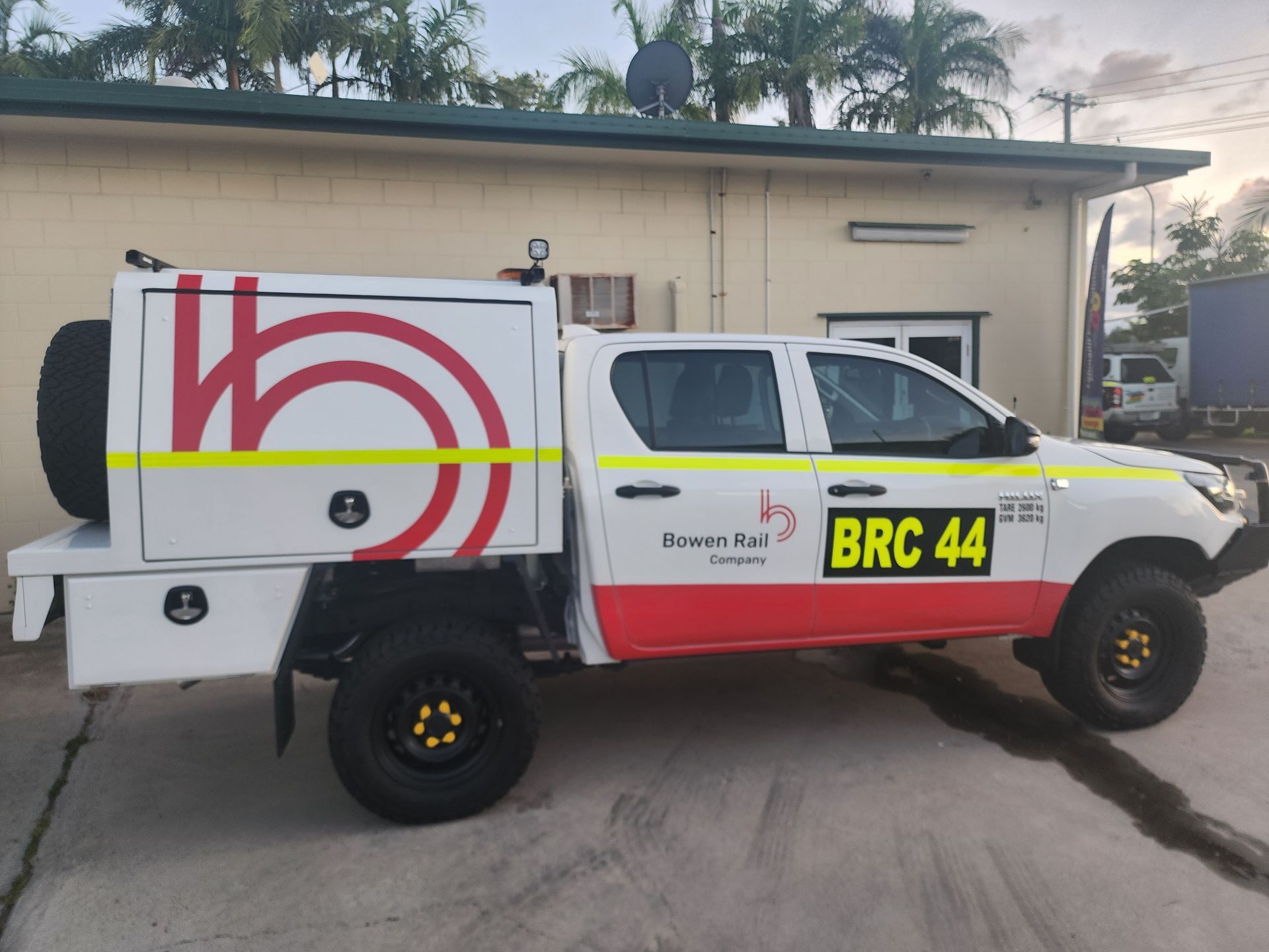 White Utility Pickup Truck With Red Logo — Lehmann Print Solutions in Bowen, QLD