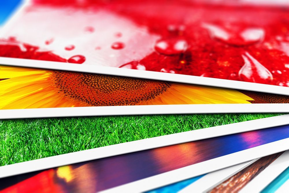 Stack of Colorful Photo Prints With Red, Yellow, Green, and Blue Abstract Scenes — Lehmann Print Solutions in Bowen, QLD