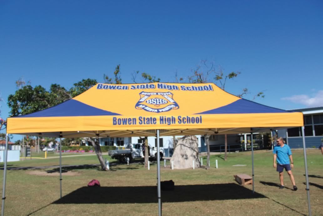 Yellow-and-blue School Event Tent With a Crest and Bowen State High School Text — Lehmann Print Solutions in Bowen, QLD