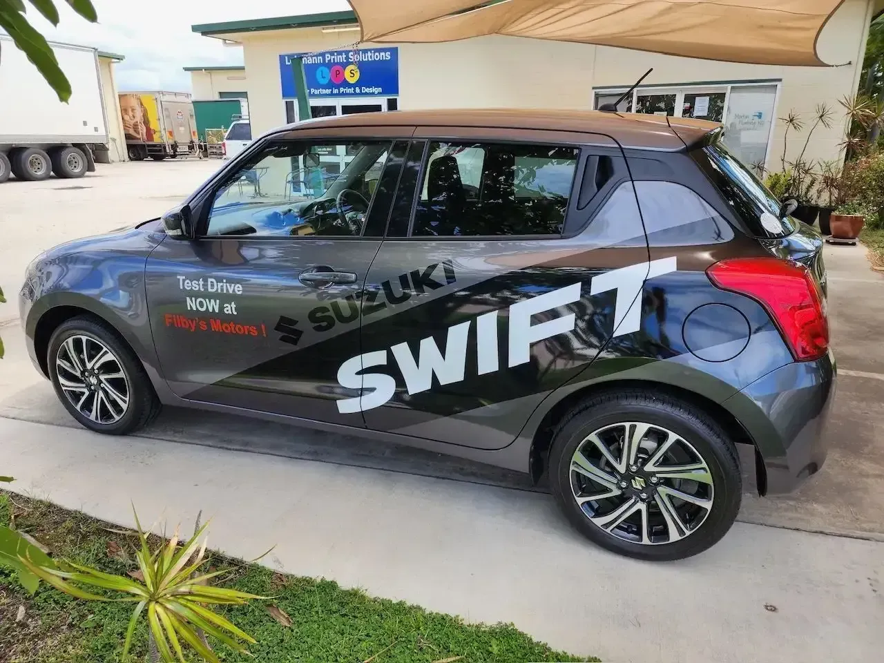 Black Suzuki SWIFT Hatchback With Promotional Decals — Lehmann Print Solutions in Airlie Beach, QLD