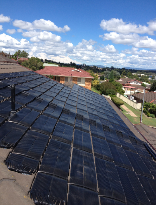 A Roof With a Lot of Solar Panels on It — Newcastle Solar Pool Heating Systems In Gosford, NSW