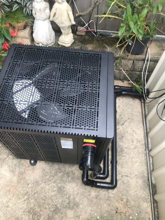 A Black Box With a Fan on Top of It is Sitting on the Ground — Newcastle Solar Pool Heating Systems In Maitland, NSW