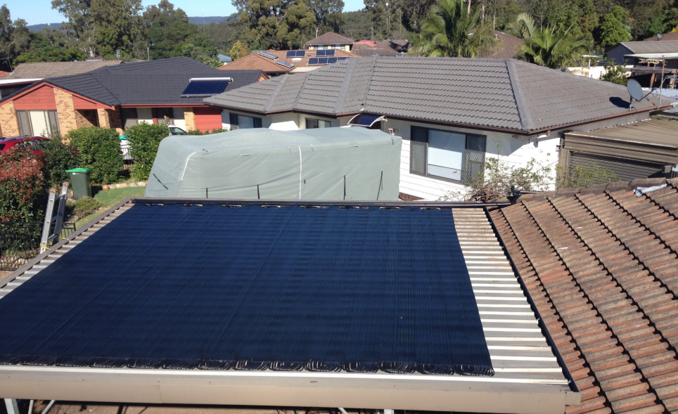 The Roof of a House Has a Solar Panel on It — Newcastle Solar Pool Heating Systems In Singleton, NSW