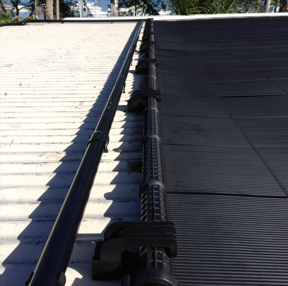 A White Roof With Avsolar Heating on It — Newcastle Solar Pool Heating Systems In Cessnock, NSW
