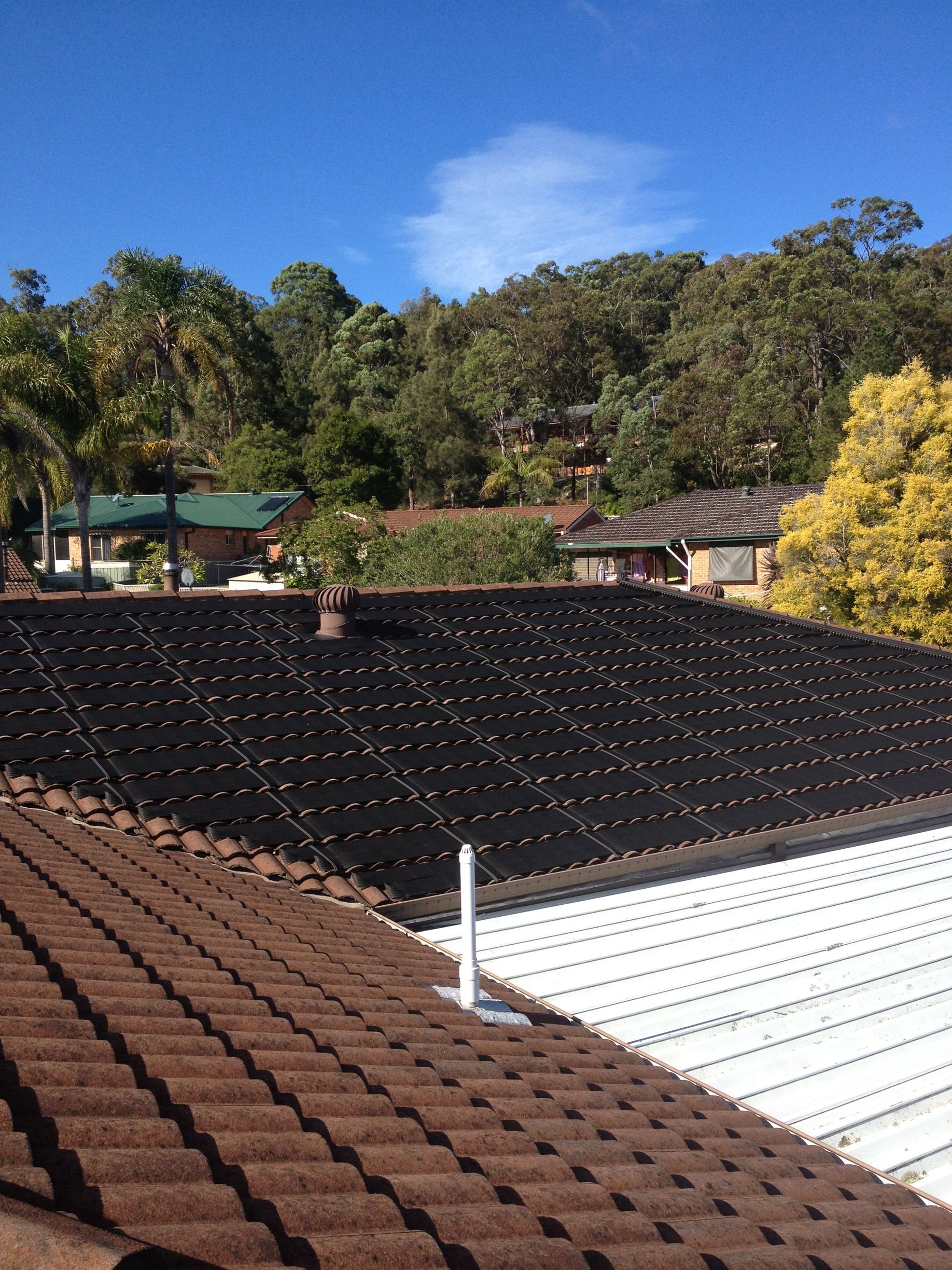A Roof With a Lot of Solar Panels on It — Newcastle Solar Pool Heating Systems In Elermore Vale, NSW