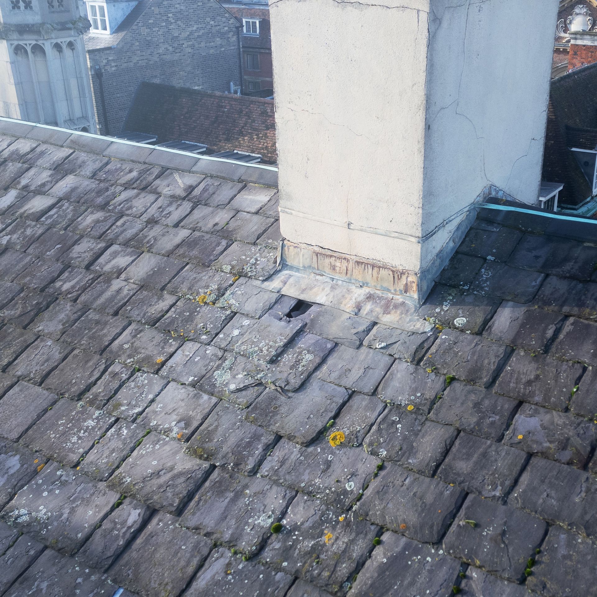 Drone roof survey shows a missing roof tile with a hole to the underlying roof fabric. 