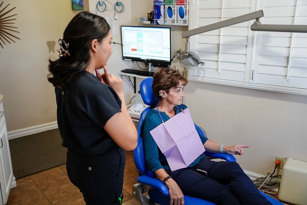 Dental exam in progress with patient in chair