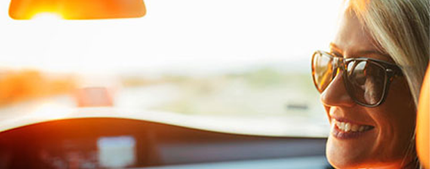 Woman Smiling Inside A Car — Minden, LA — McInnis Insurance Agency, Inc. Woman Smiling Inside A Car — Minden, LA — McInnis Insurance Agency, Inc.