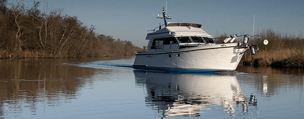 White Boat In A River — Minden, LA — McInnis Insurance Agency, Inc. White Boat In A River — Minden, LA — McInnis Insurance Agency, Inc.