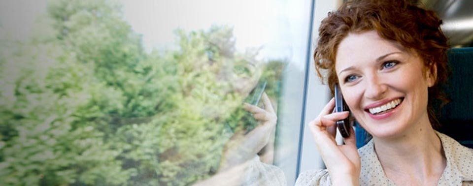 Smiling Girl With Phone — Minden, LA — McInnis Insurance Agency, Inc.