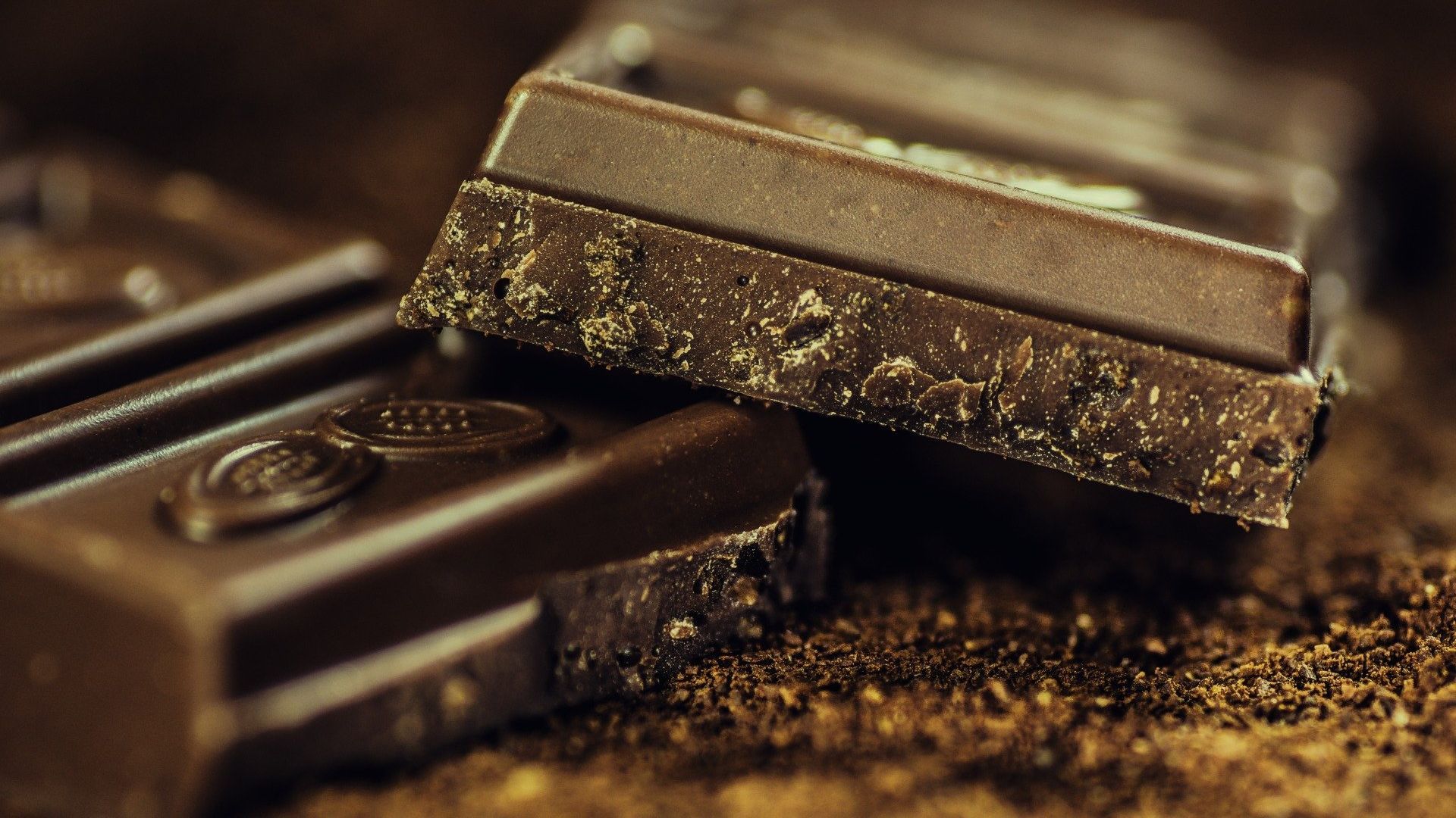 A close up of a chocolate bar with a bite taken out of it.