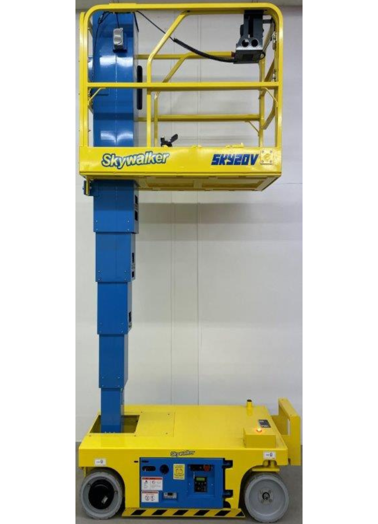A yellow and blue aerial lift with the word ready on it