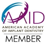 American Academy of Implant Dentistry member logo in blue, purple, and black text