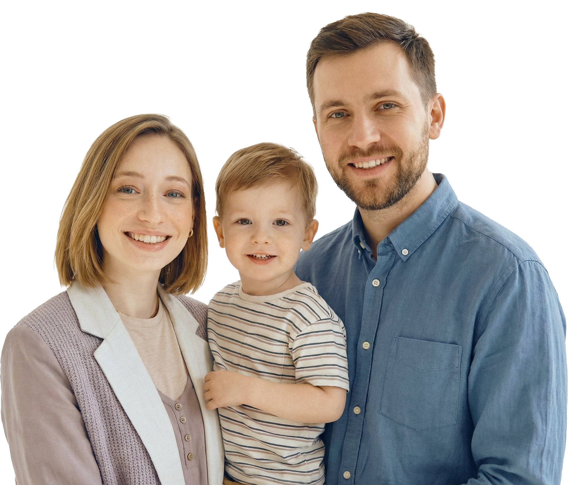 Smiling family of three standing together against a white background, wearing casual clothes.