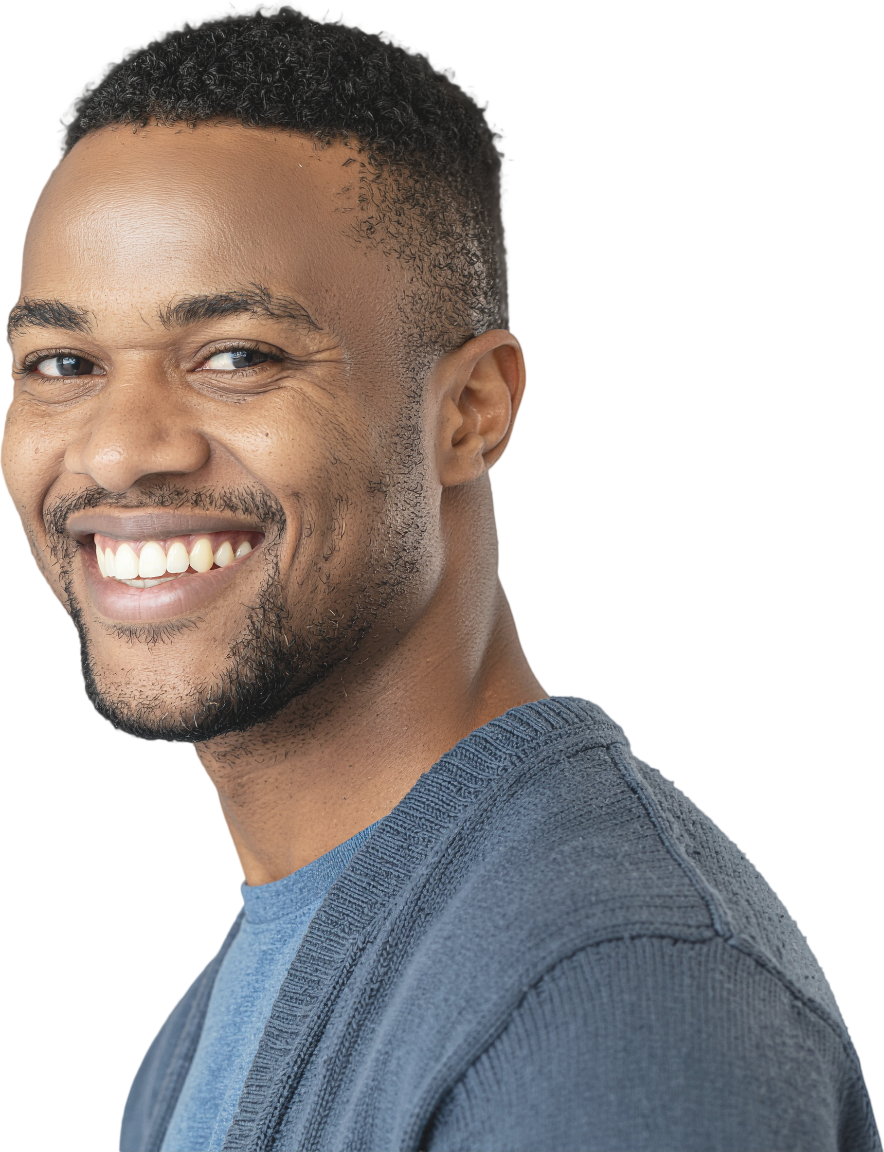 Smiling man in a blue shirt, turned slightly sideways against a white background