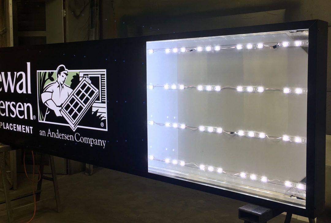Lighted sign for Sewell Andersen placement featuring logo and LED lights.