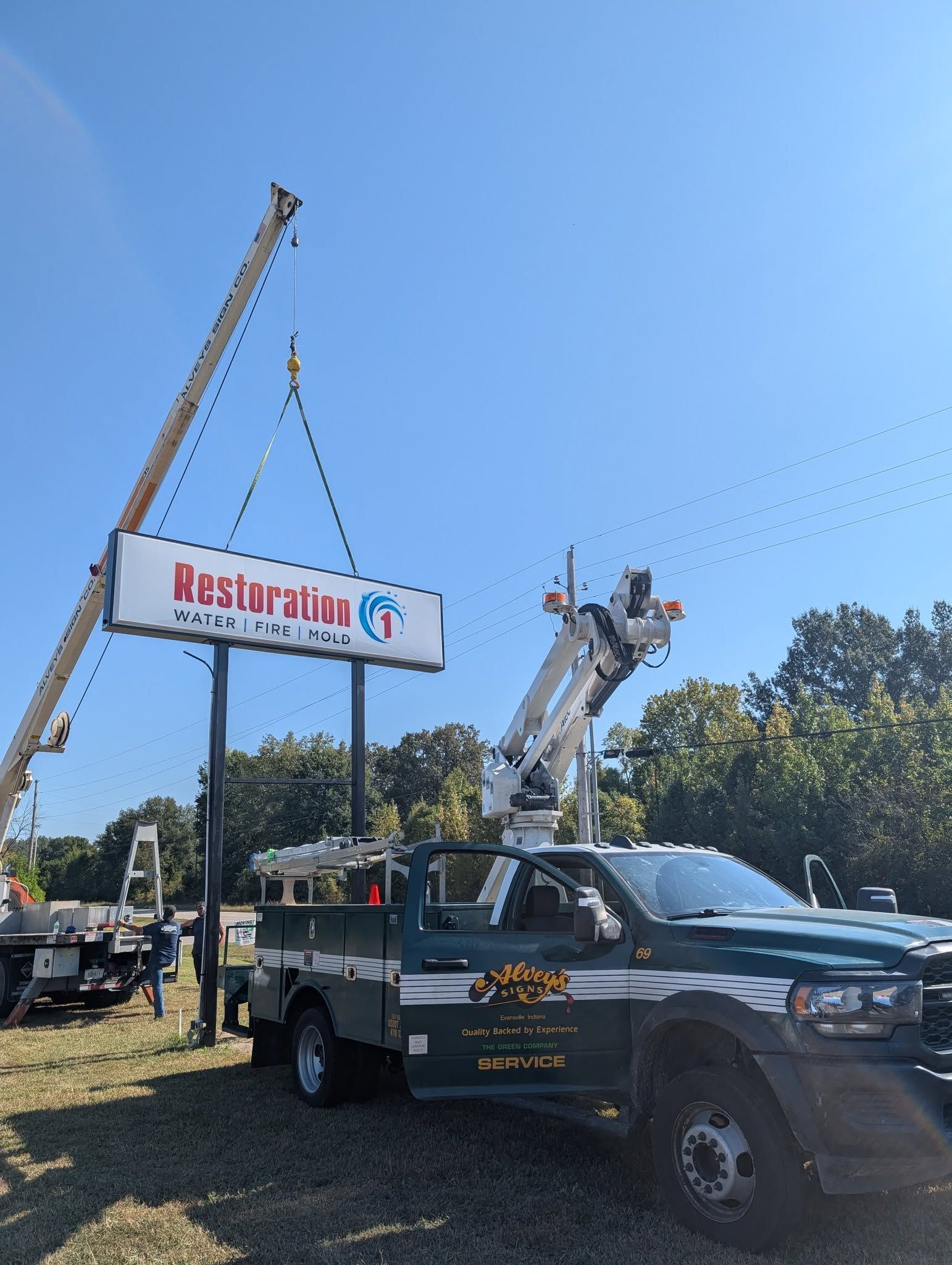 A crane lifts a large