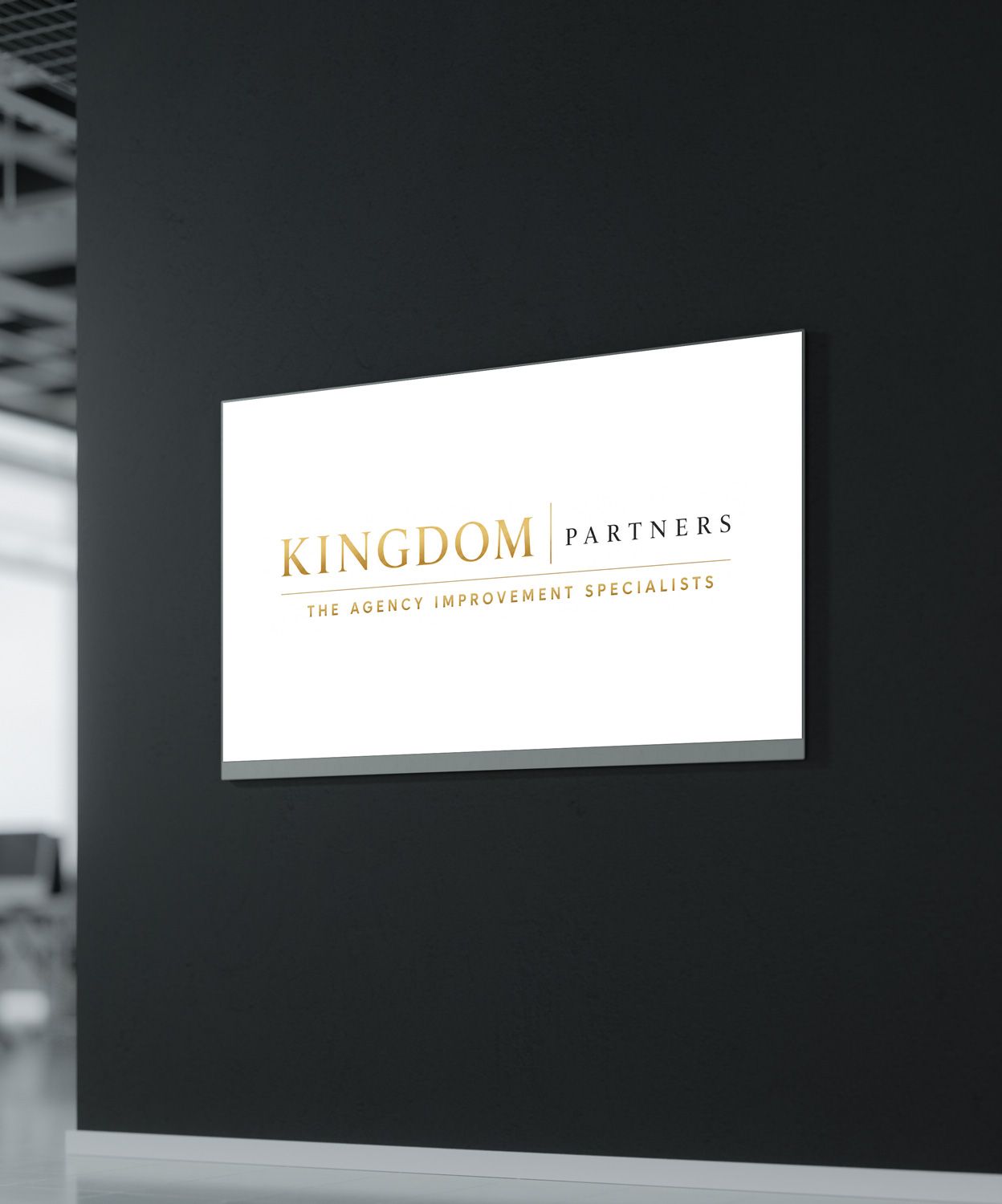 Blue wall sign reading “KINGDOM GROWTH PARTNERS” with a gold crown logo