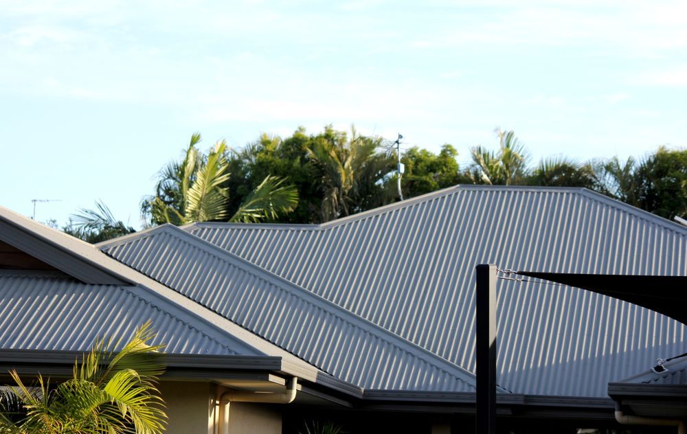 Gray Corrugated Metal Roof of a House — Gibson Plumbing & Roofing Pty Ltd in Gladstone Central, QLD
