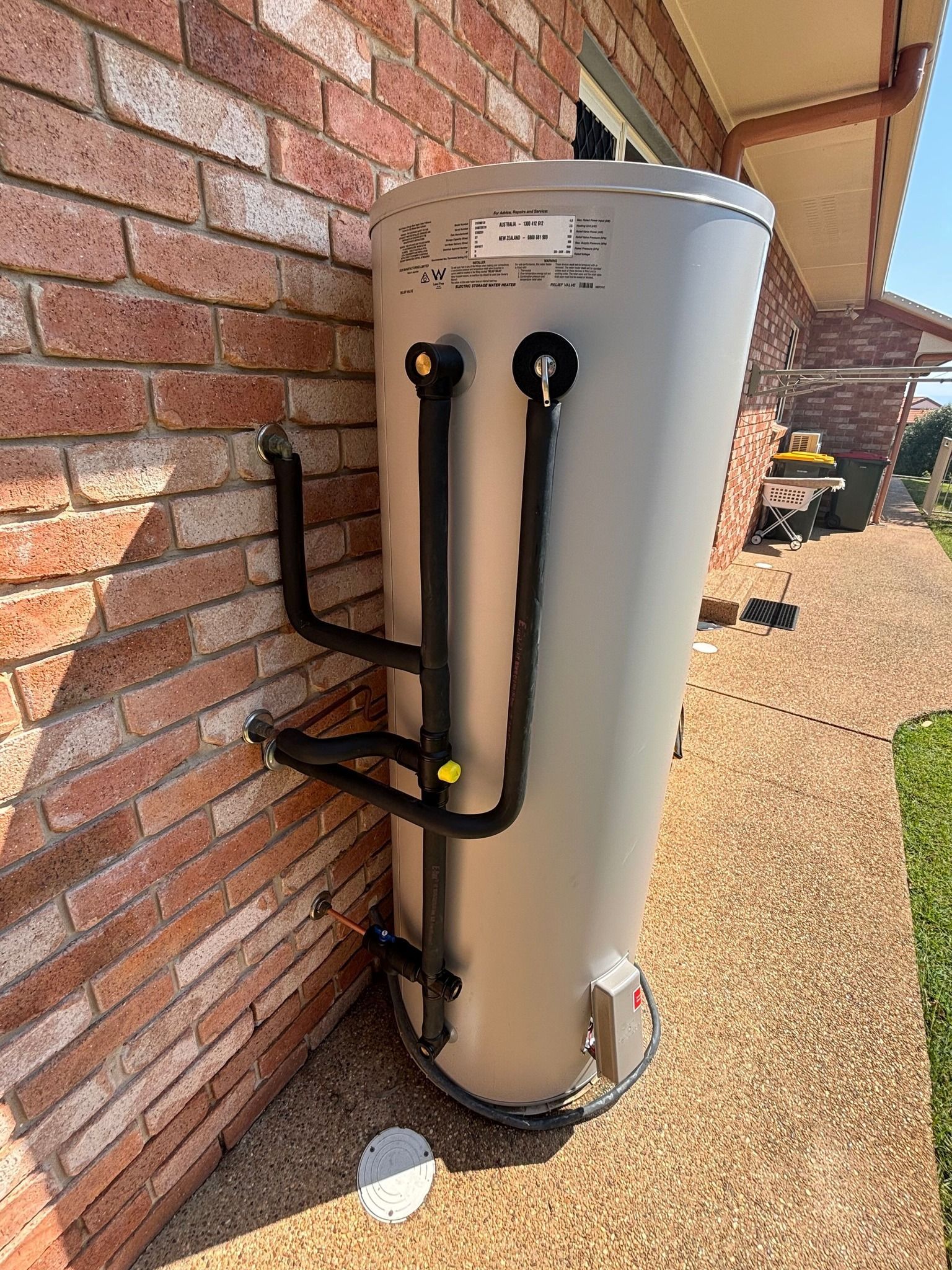 Technician Repairing an Outdoor Gas Meter and Pipes — Gibson Plumbing & Roofing Pty Ltd in Gladstone Central, QLD