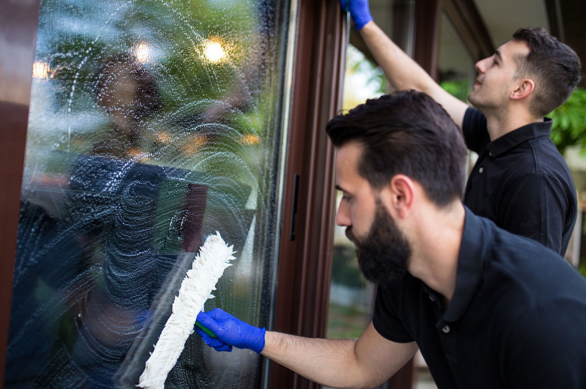Two Men Cleaning the Window — Champaign, IL — Precision Maintenance