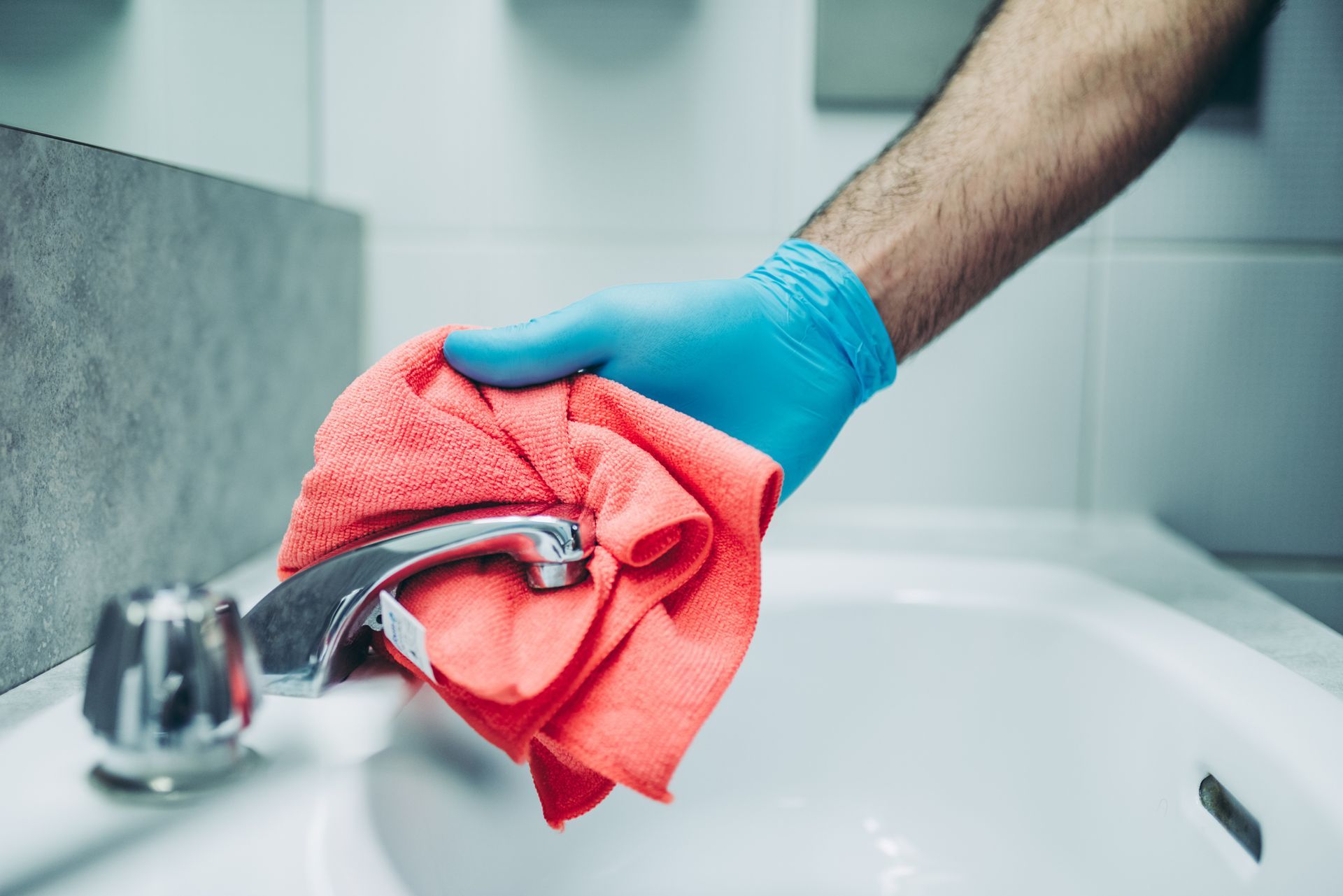 Worker Cleaning the Sink — Champaign, IL — Precision Maintenance