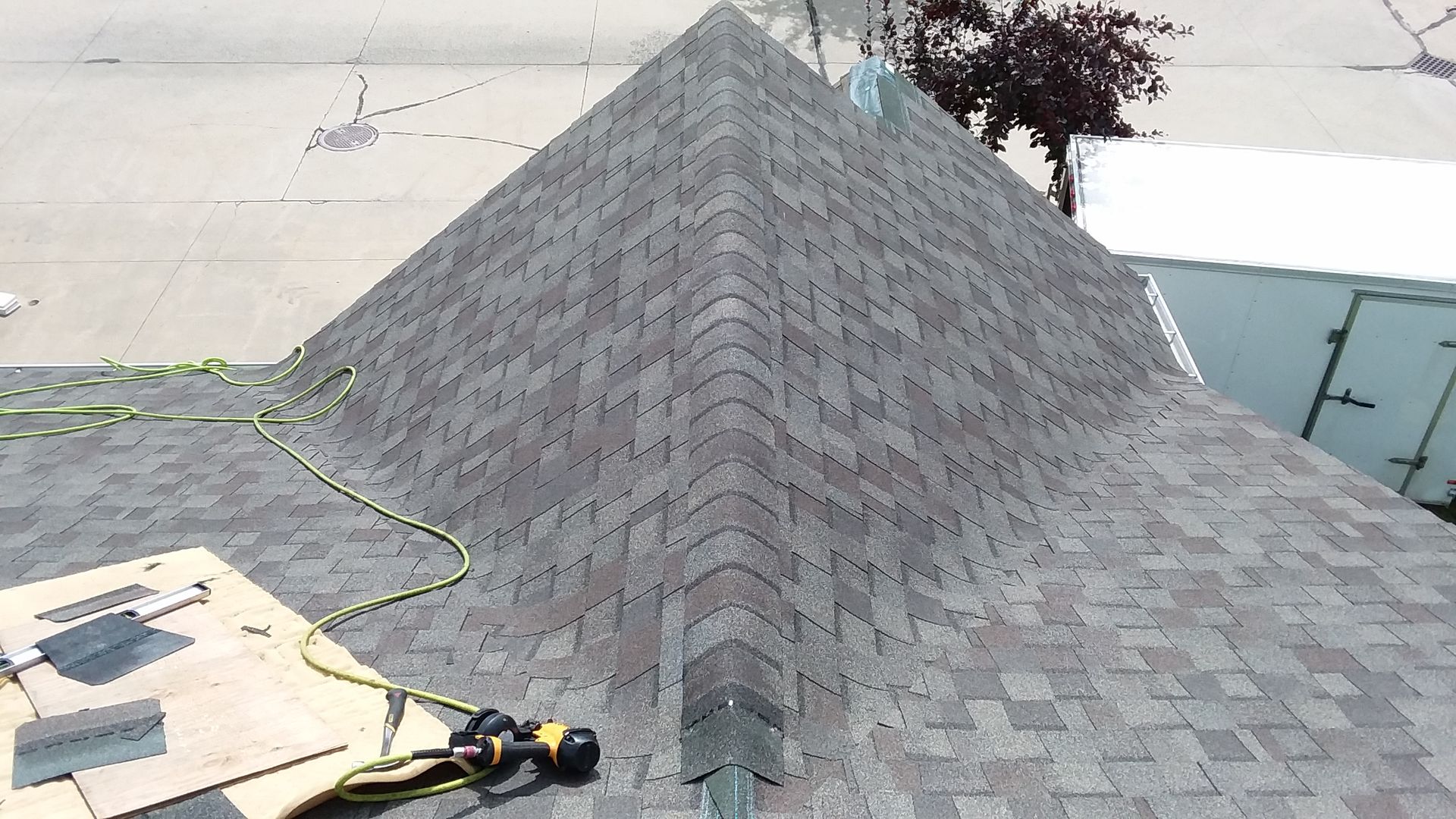 Landmark Dimensional Shingles in color Weathered Wood Being Installed on a Residential Roof in Fargo-Moorhead