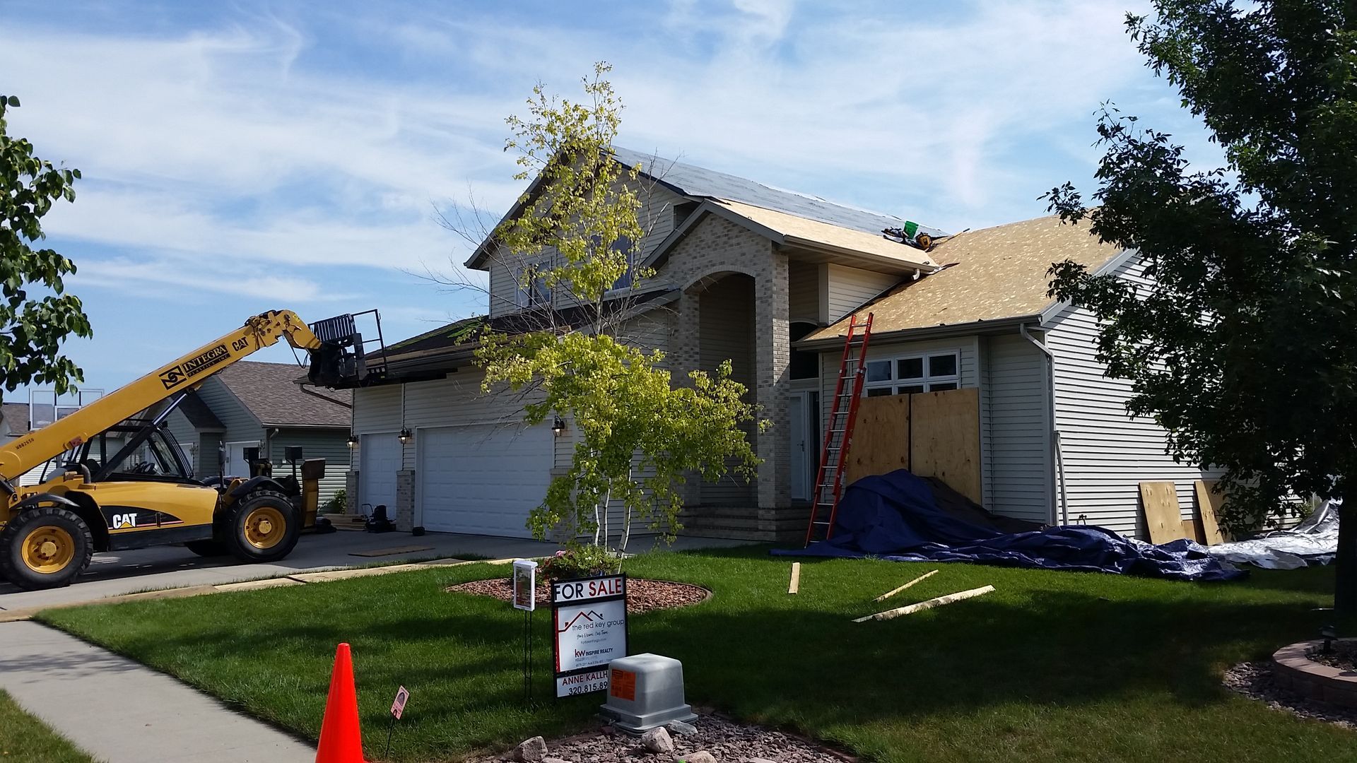 Forklift Moving Asphalt Shingle Materials to Edge of Roof in West Fargo-ND