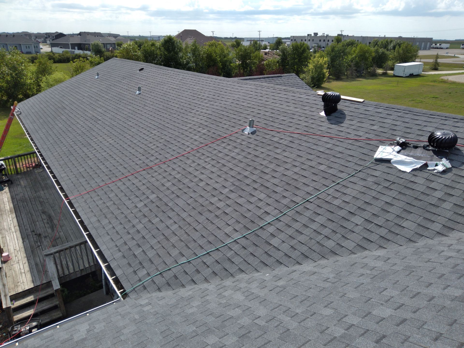 Final install inspection for an Ada, Minnesota architectural asphalt roof installed using whirlybird turbine ventilation