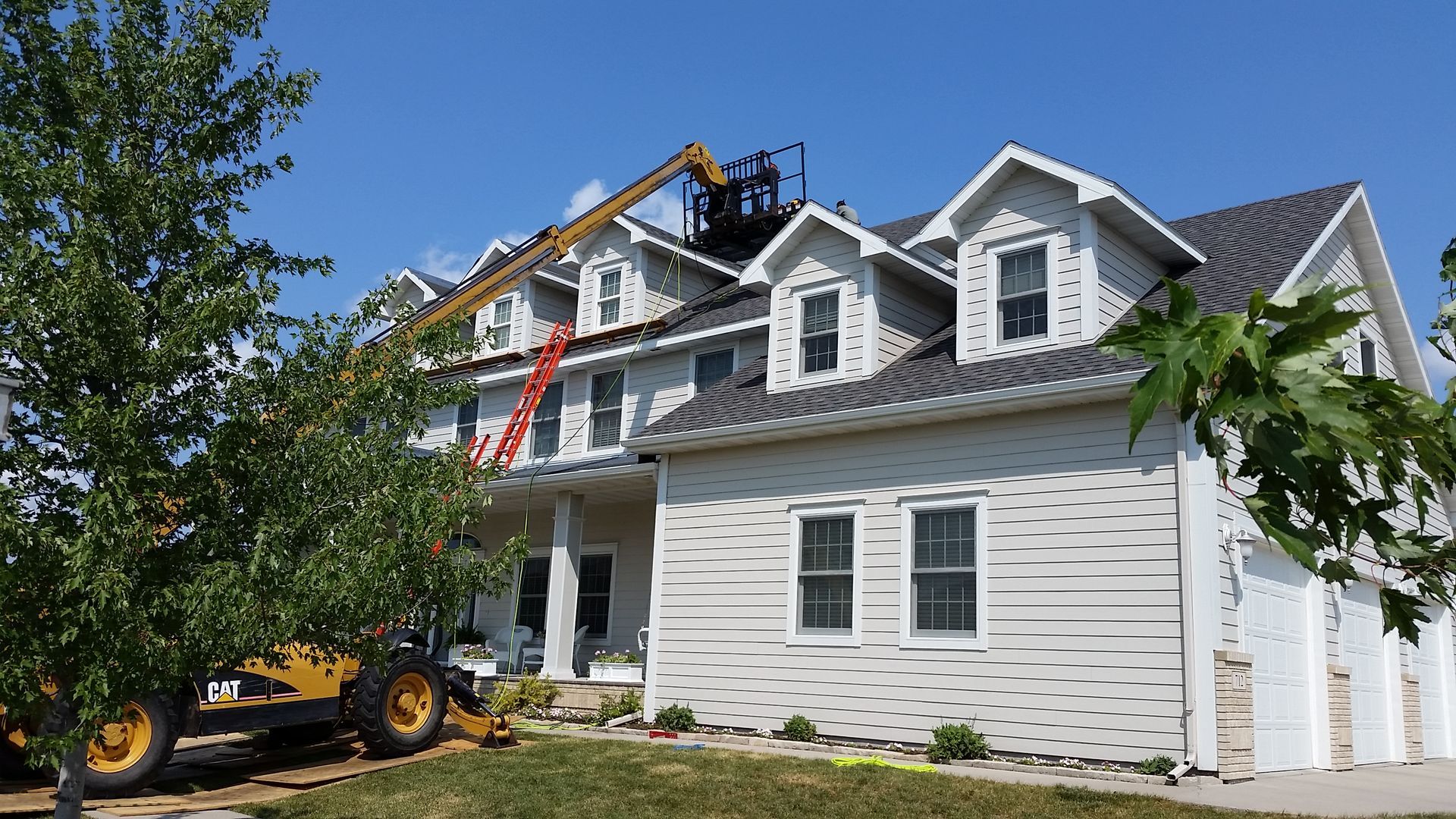 House with Dormers having the Roof Replaced in Shoreham, MN with Help of Forklift
