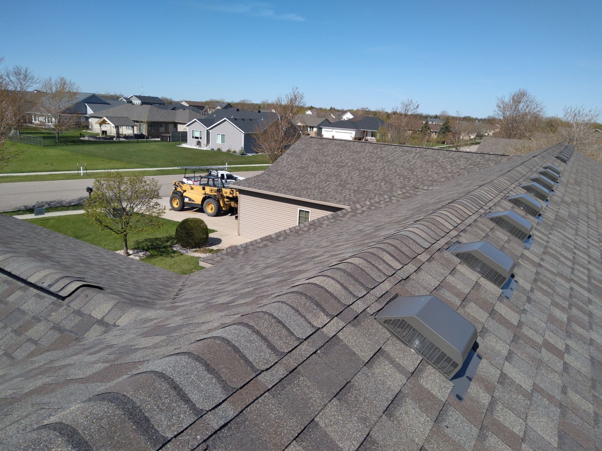 Class 3 shingle roof installation completed on a twin home with slant back and ridge ventilation in Hawley Minnesota