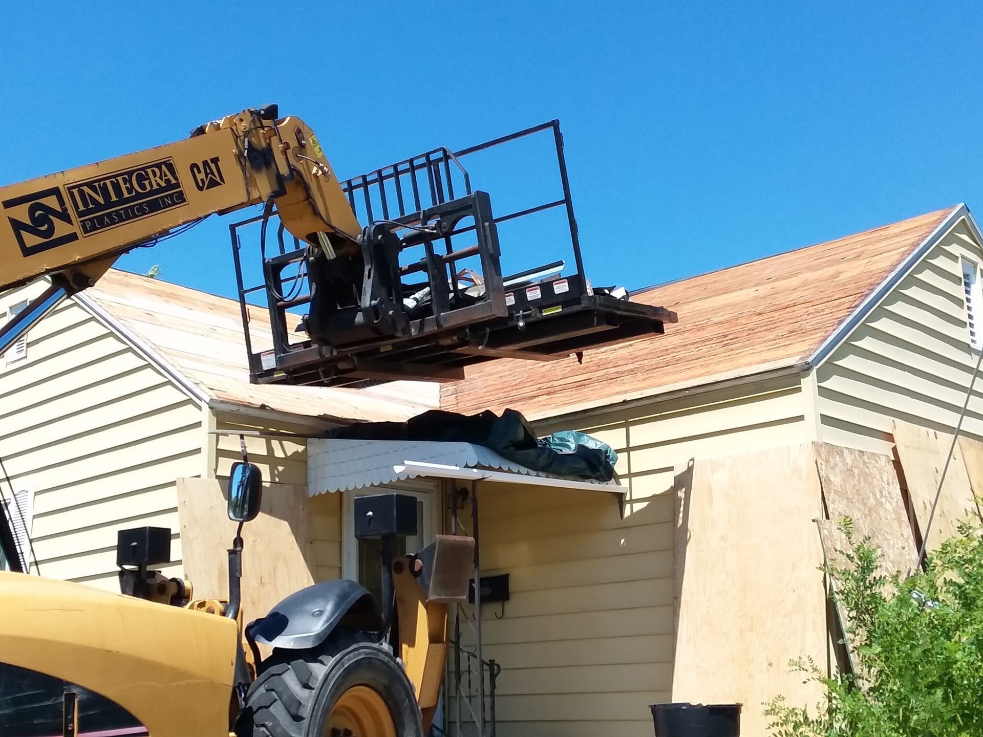 Roof decking stripped of shingles, roofing felt and nails near Fargo-Moorhead on a Gable Frame Dwelling