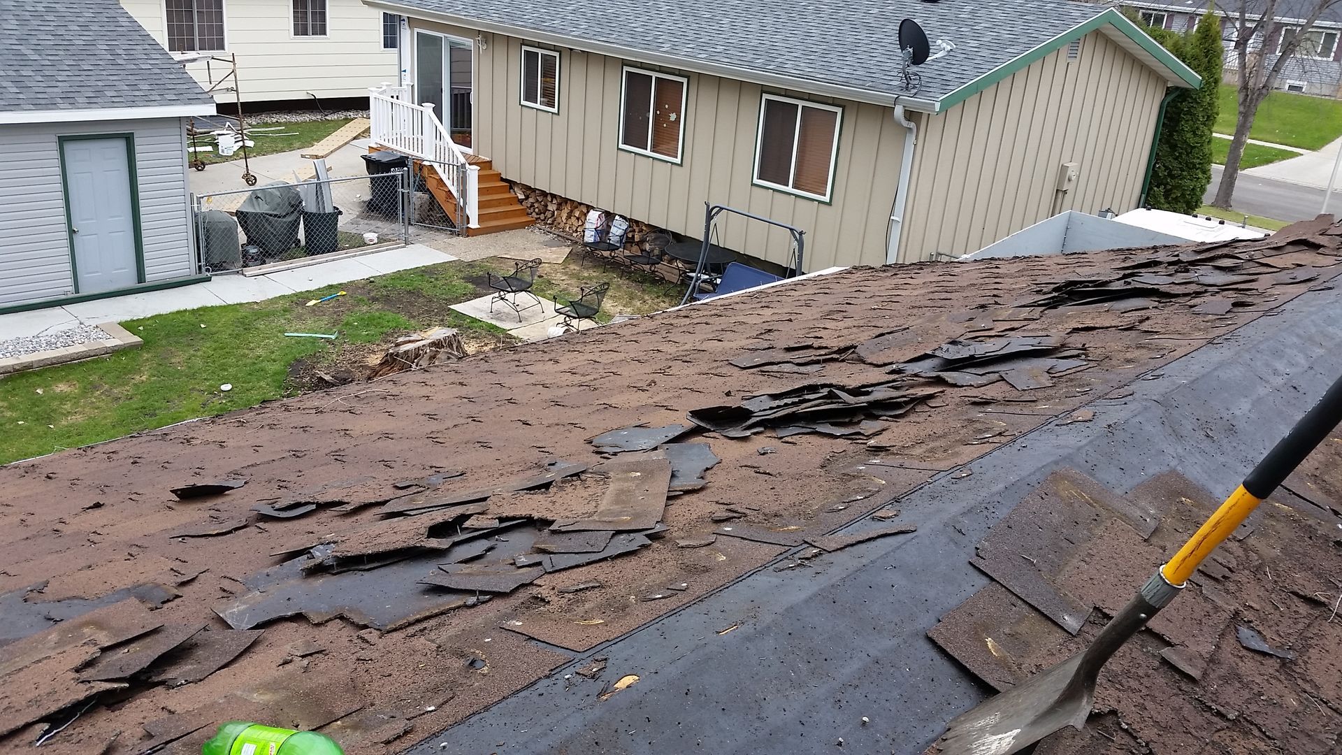 Old Brittle Asphalt Shingles being Removed in Vergas-MN