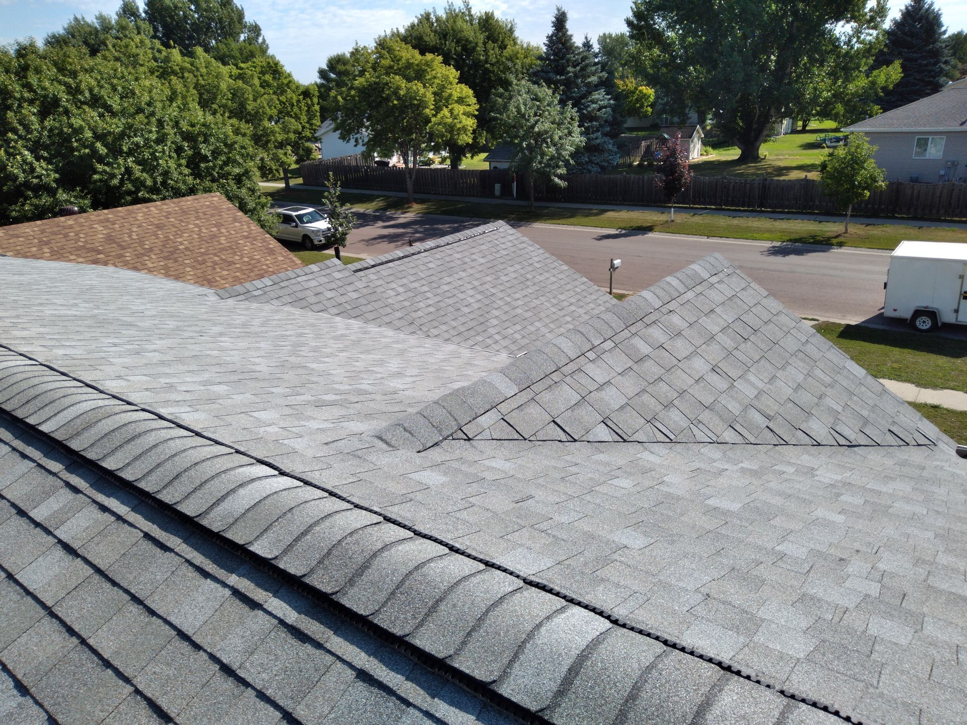 Casselton, ND roof installed with Class 3 CertainTeed composite shingles with low profile shingle over ridge vents on peaks