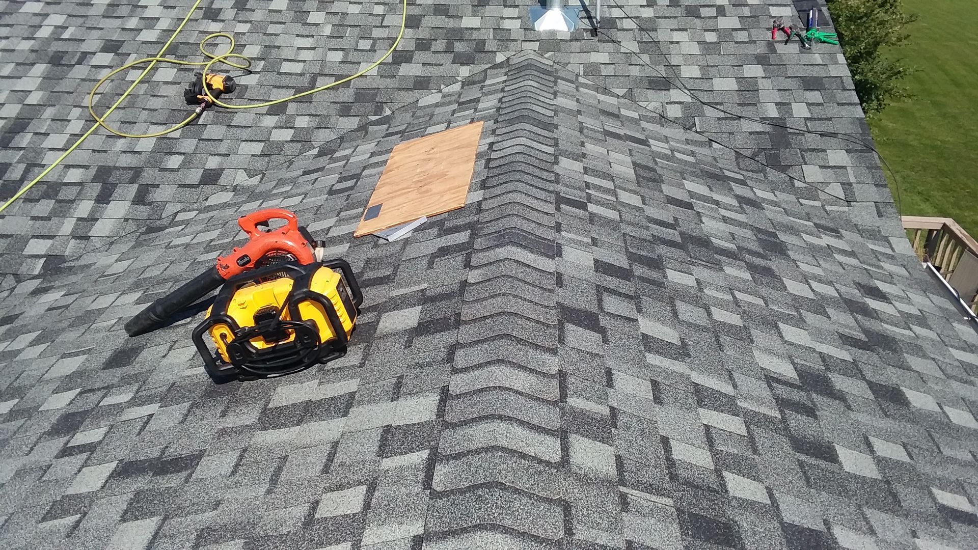 Roofing Tools on a Roof in West Fargo, ND using CertainTeed Impact Resistant Granite Colored Shingles