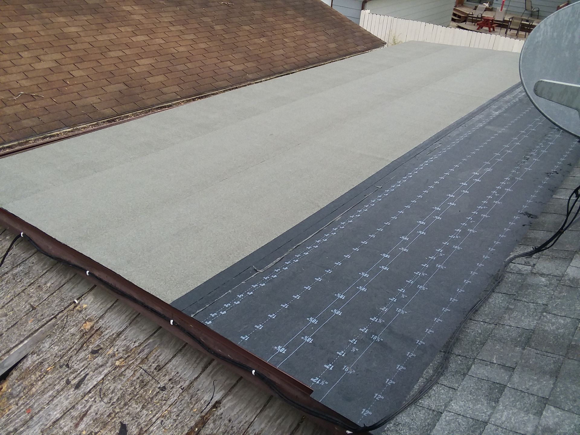 Roof Halfway Installed with Gray Granule Cap Sheet on top of Base Layer in Ottertail, MN