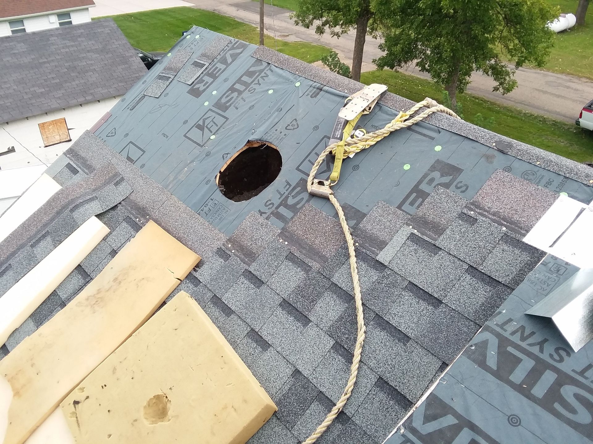 Castlebrook Shingles Installed on a Steep Pitch Roof with Turbine Vent and Step Flashing near the West Fargo-Moorhead area