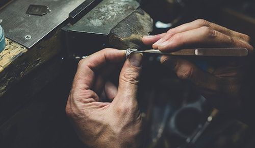 Hands Working on Diamond Ring — Ringgold, GA — The Vault Coin & Jewelry Hands Working on Diamond Ring — Ringgold, GA — The Vault Coin & Jewelry